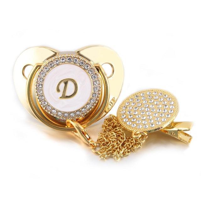 Chupeta Dourada BIBIA™ + Prendedor Strass