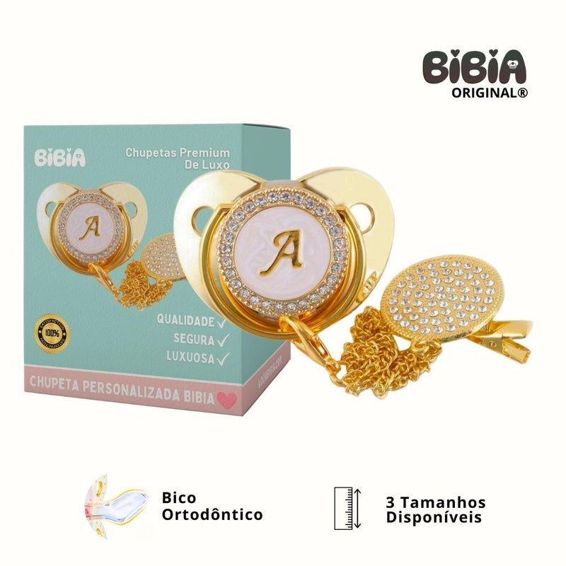 Chupeta Dourada BIBIA™ + Prendedor Strass