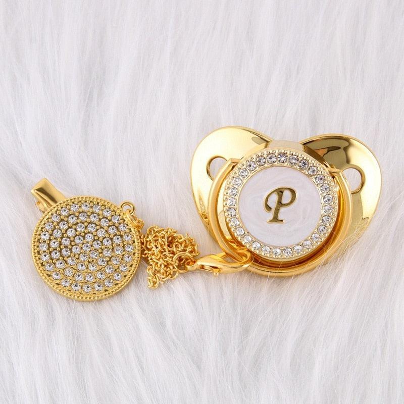Chupeta Dourada BIBIA™ + Prendedor Strass