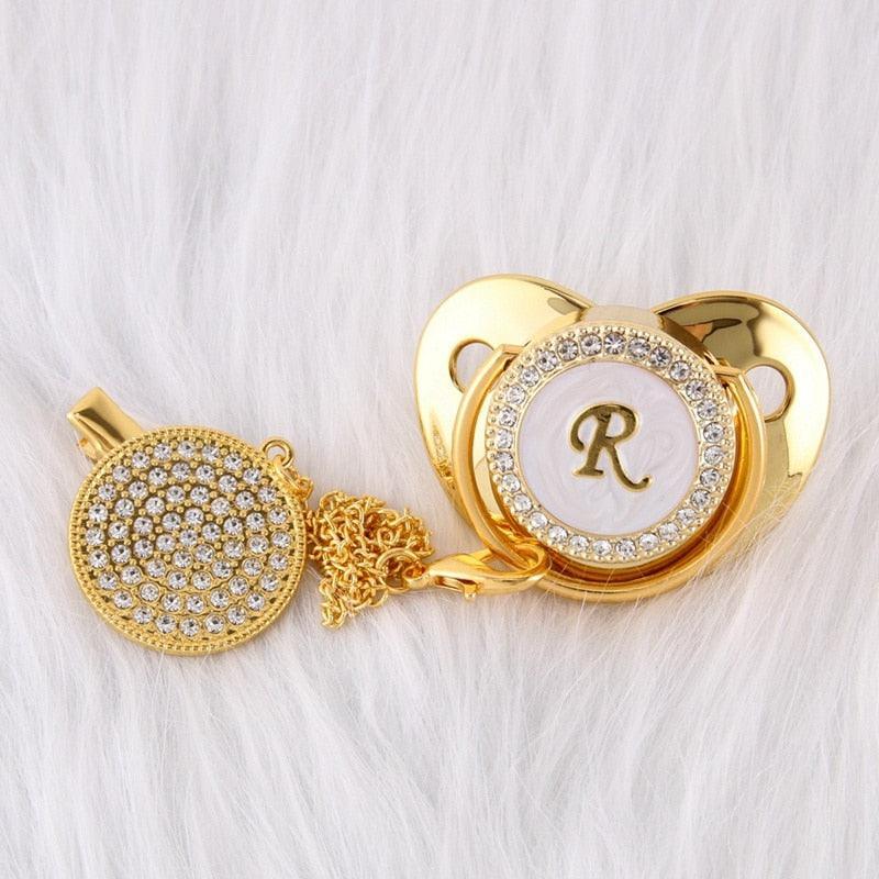 Chupeta Dourada BIBIA™ + Prendedor Strass