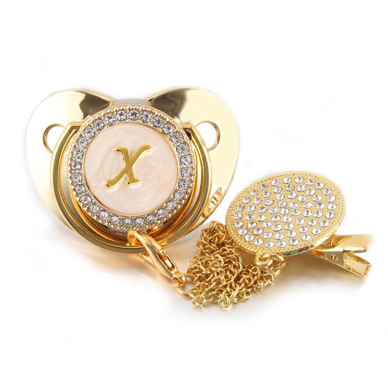 Chupeta Dourada BIBIA™ + Prendedor Strass
