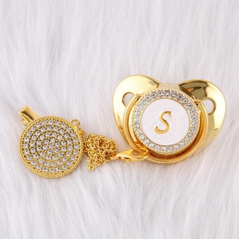 Chupeta Dourada BIBIA™ + Prendedor Strass