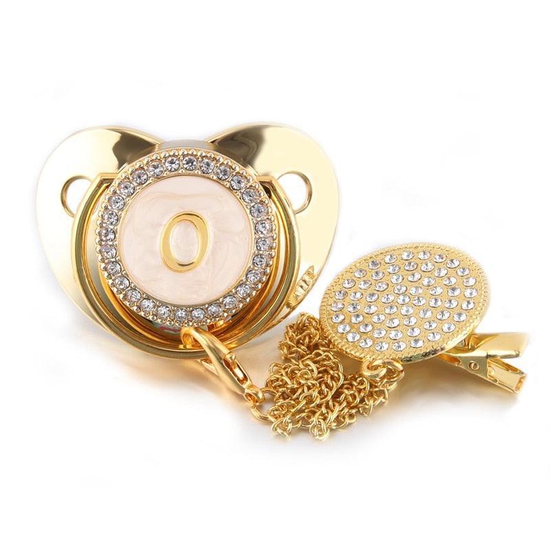 Chupeta Dourada BIBIA™ + Prendedor Strass